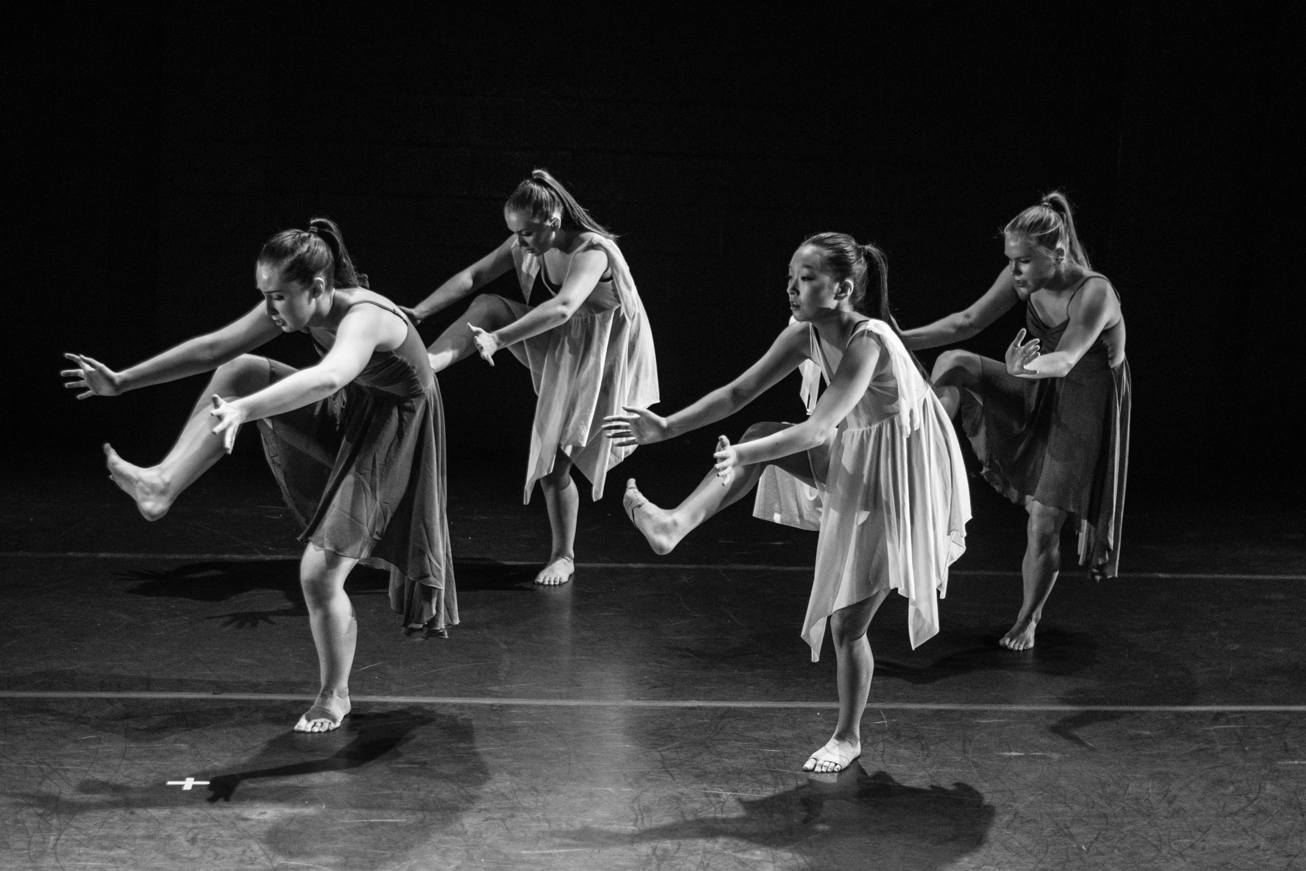four women dancing grayscale photography
